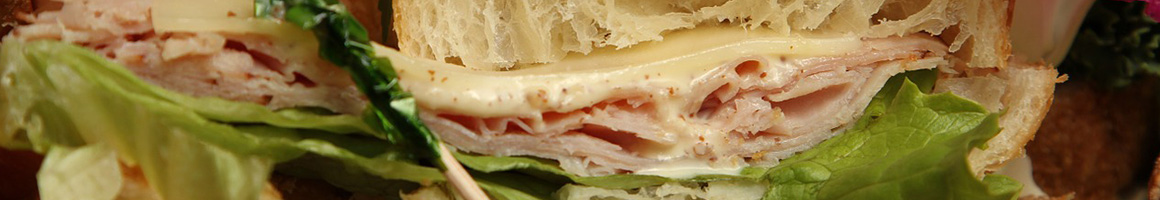 Eating Deli Hawaiian Sandwich at Longboards Wraps & Bowls restaurant in Mission, KS.